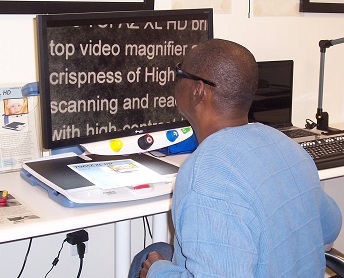 Man using a screen magnifier to read. 