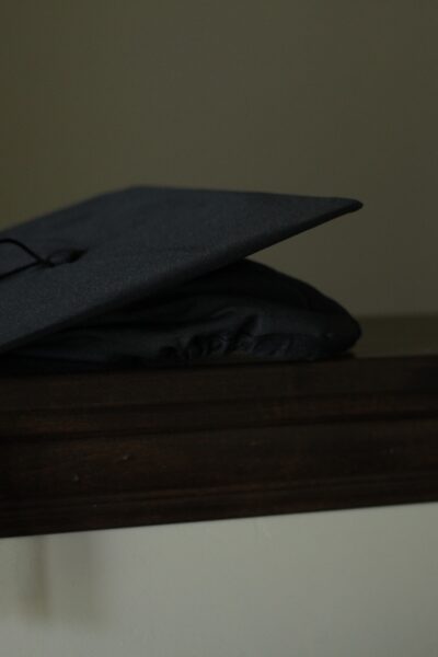 Photo of graduation cap lying on a shelf