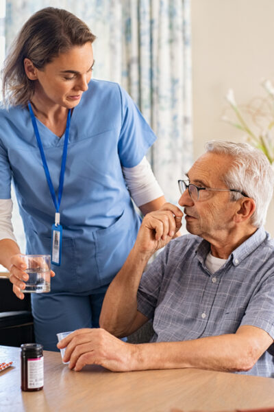 Nurse talking with a group of older people