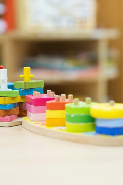 Preschool shelf with stackable puzzle. 