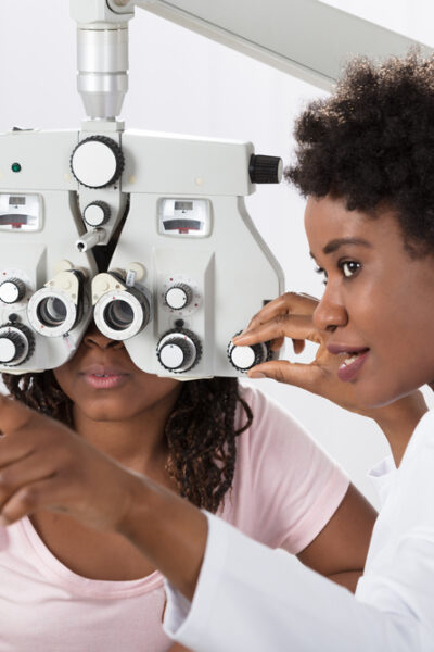 eyecare professional giving an eye exam